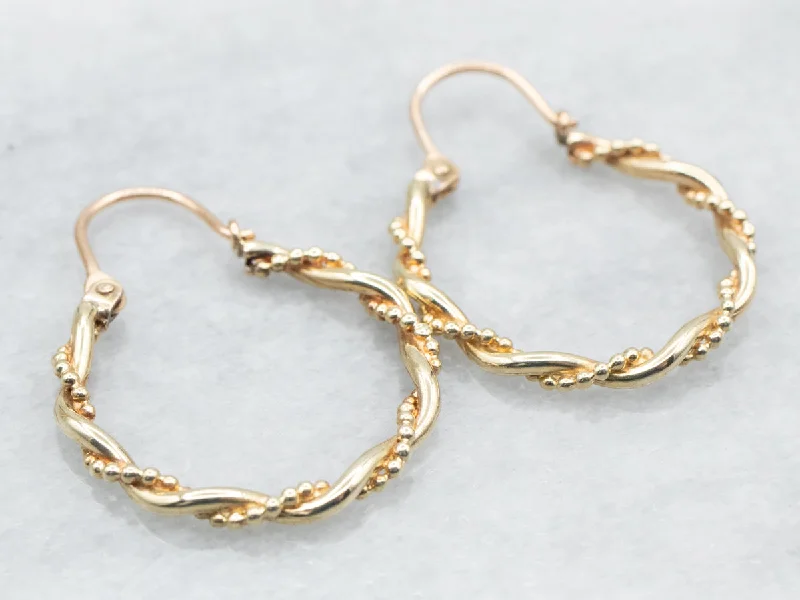 Hoop earrings with rhinestone embellishments for a glamorous and sparkling look-Yellow Gold Twisted Hoop Earrings